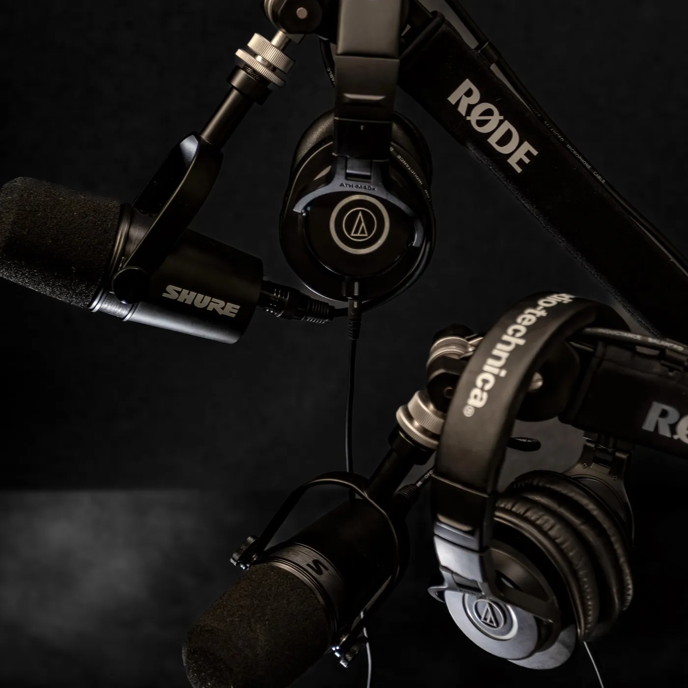 RODE boom arms, Shure microphones and headphones in the PodPro studio